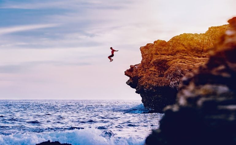 Man jumping into water